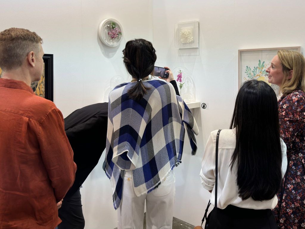 Visitors viewing and photographing botanical sculptures by Annette Townsend at Art Central 2023, Hong Kong.