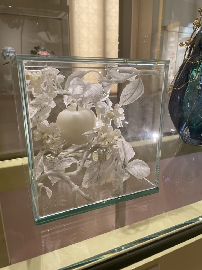 Wax sculpture Tree of the Knowledge of Good and Evil displayed in a glass vitrine within the Love section of Homo Faber 2024.
