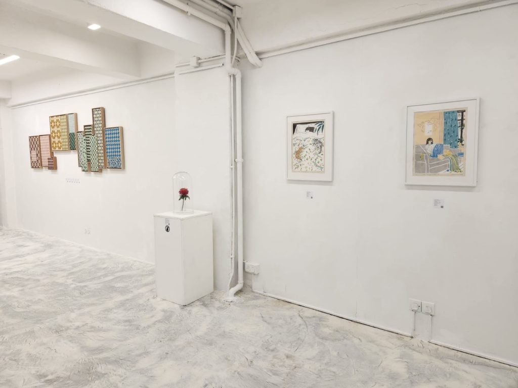 Installation view of Defying Boundaries: Female Vision at Karin Weber Gallery, Hong Kong, showing Autumn Chrysanthemum displayed beneath a glass dome alongside works by other gallery artists.