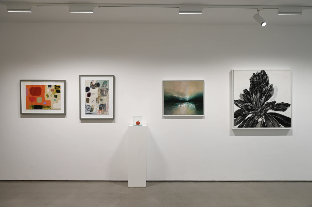 Installation view of Celf Gallery's Summer Exhibition, Cardiff, showing Paradise Lost displayed in a glass vitrine on a plinth between larger paintings.