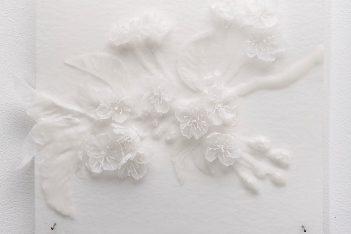 Close-up detail of white wax blossom sculpture from ‘Flight of the Bumblebees’ series